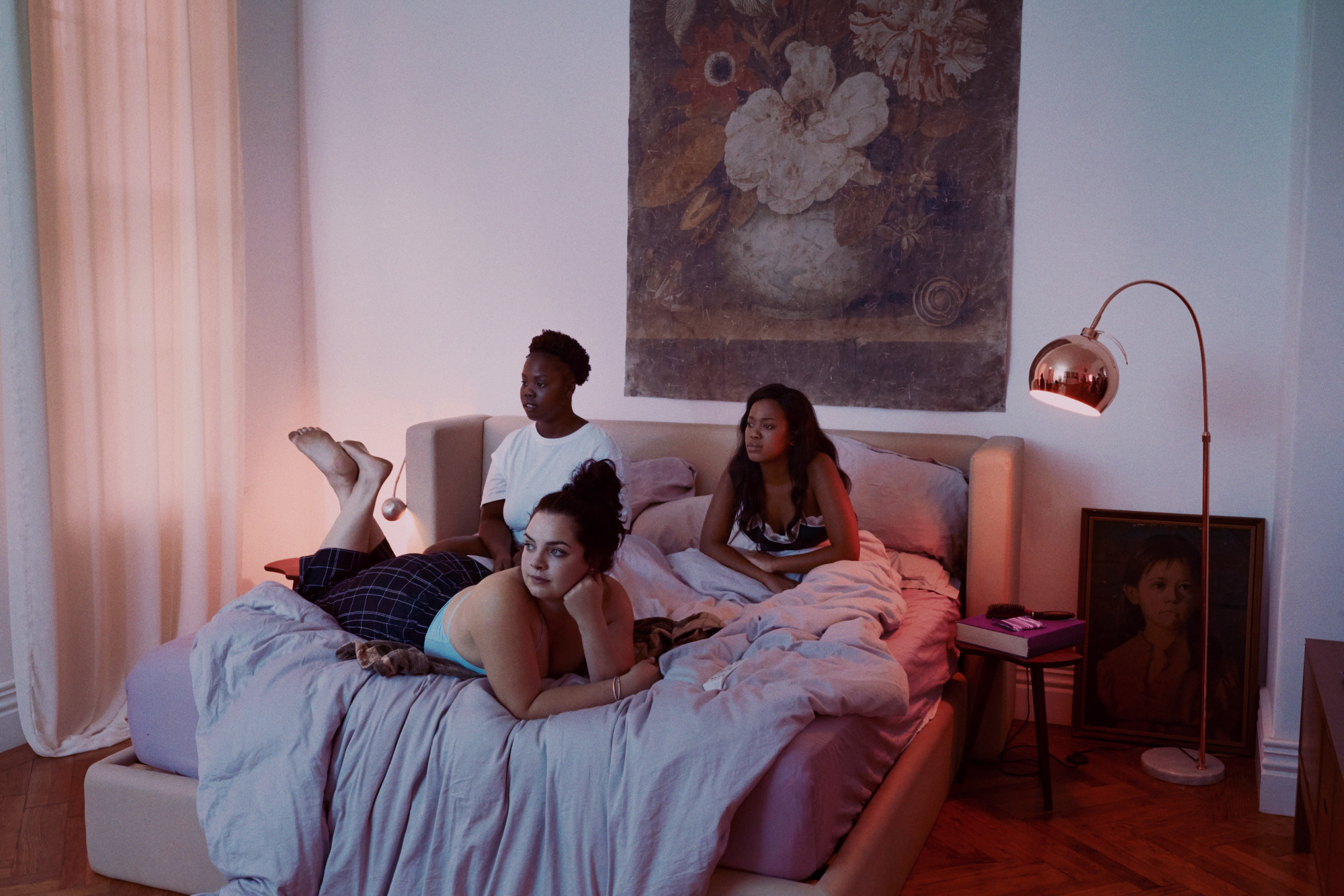 Girls sitting on a bed